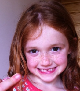 Liza Miller, age 5.  First tooth in hand.